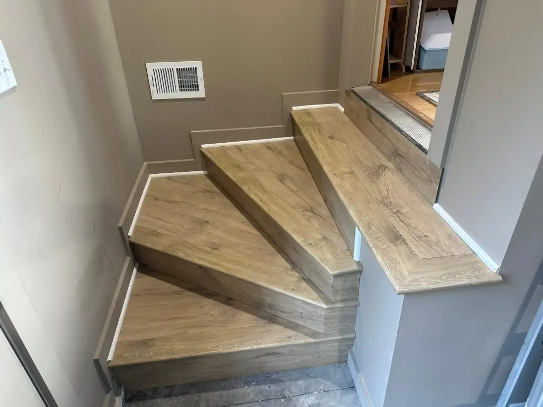 Worn hardwood floor before JRK Flooring’s work